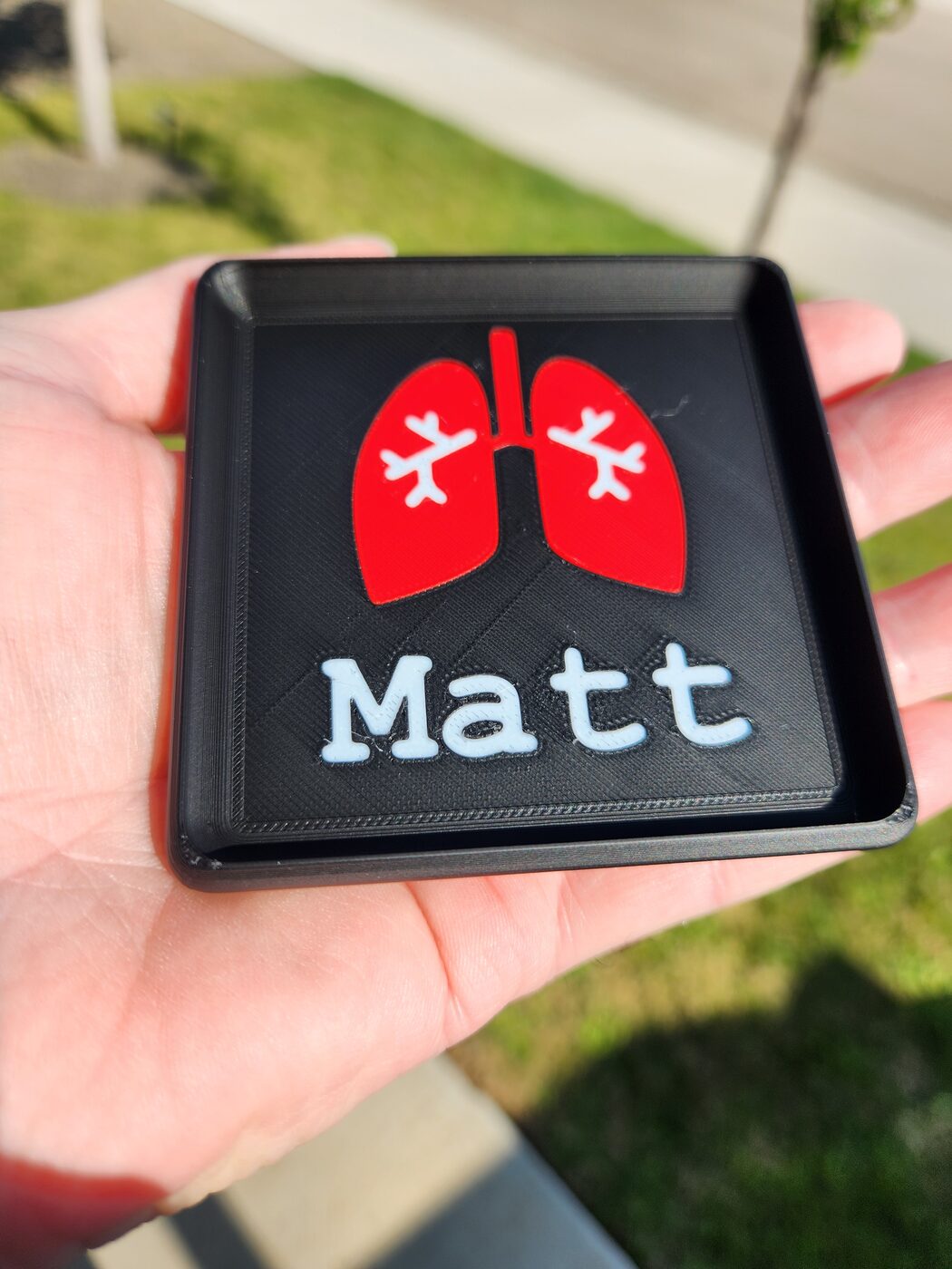 Lungs pill dump tray held in sunlight